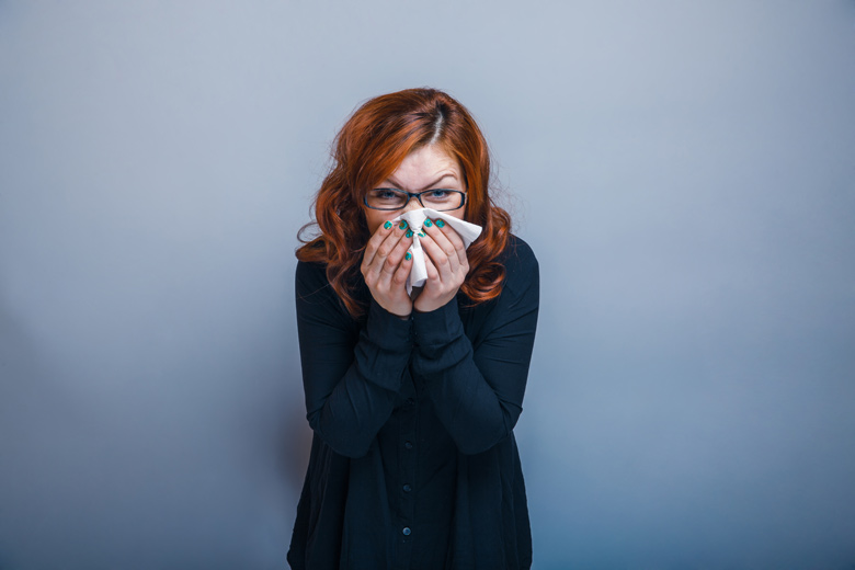 Woman Sneezing